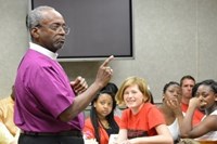 Presiding Bishop-elect Michael Curry speaks during a breakfast for young participants in the Aug. 15 pilgrimage to commemorate Jonathan Daniels and the other martyrs of the civil rights movement in Alabama. Curry later said in his sermon that the gathering reminded him it was time to pass the torch to a new generation who will continue the struggle for equal rights. 