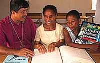 Claudette Mbevavy with Bishop Roger Chung and friend