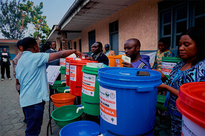 Ebola response kits, including handwashing stations and hygiene supplies, are distributed to local representatives in the Diocese of Goma.